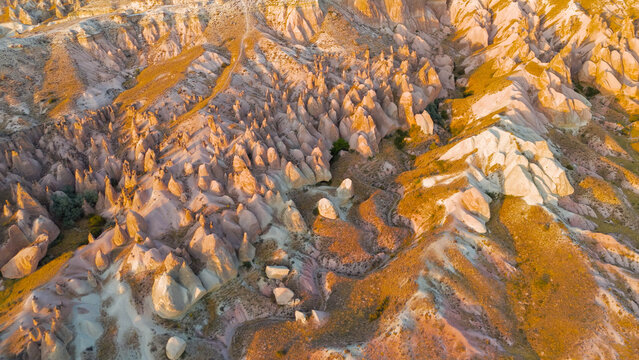 Goreme, Nevsehir, Turkey. Detailed aerial shot of Devrent Valley revealing intricate erosion details and rock textures during evening light.. Aerial View