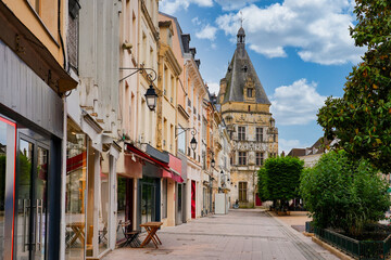 Fototapeta premium Pedestrian shopping street of Maurice Viollette in the historic city center of Dreux leading to the Renaissance belfry, Eure-et-Loir, France