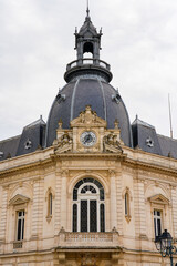 Fototapeta premium Elegant 19th-century Beaux-Arts building with a grand imperial dome, ornate clock, and stone carvings in Dreux, France