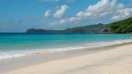 Fototapeta premium Turquoise ocean waves rolling onto a sandy beach with distant green hills and blue sky