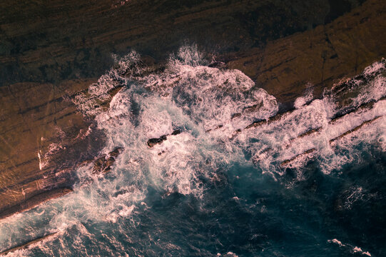 Aerial view ocean water hits coral in the beach at Sawarna Beach Bayah Banten Indonesia