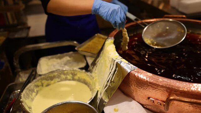 Chef Deep Frying Shrimp Tempura in Large Copper Pot Osaka Japan