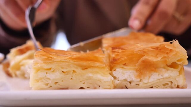 Enjoying turkish borek in a cafe in the afternoon