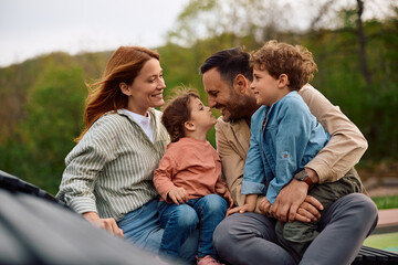 Fototapeta premium Happy parents enjoying in spending time with their children in nature.