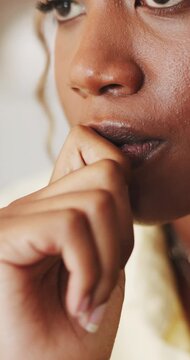 Bite, nails and woman with depression, anxiety and mental health from overthinking alone in house. Nervous, coping mechanism and black person in home with stress, contemplation and worry for future.