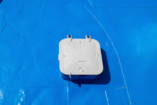 white metal raised ship deck hatch