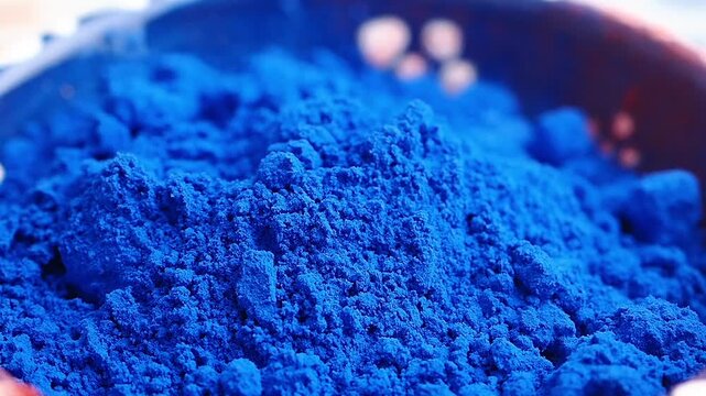 Bright blue powder in a bowl at a market stall