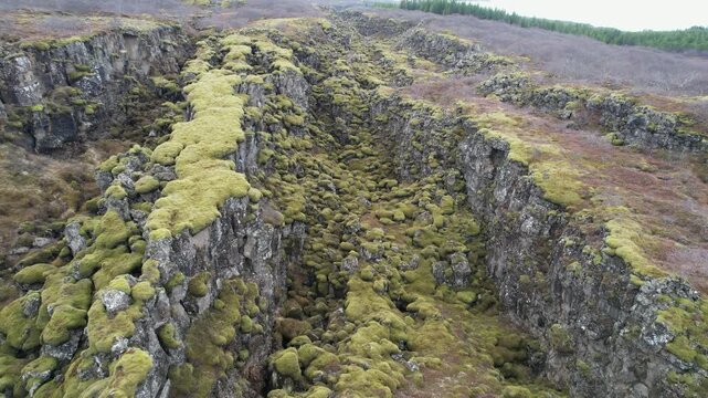 Aerial view of the Silfra fissure tectonic plates covered with green moss in Thingvellir National Park, Iceland