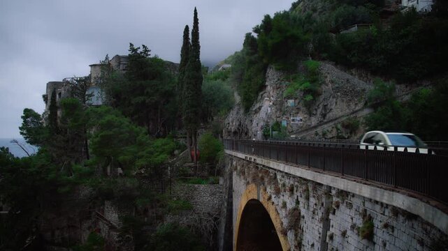 Historic Arched Bridge Over Fiordo di Furore in the Province of Salerno, Amalfi, Italy. - wide shot