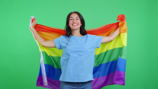 Woman proudly waving a rainbow lgbt flag