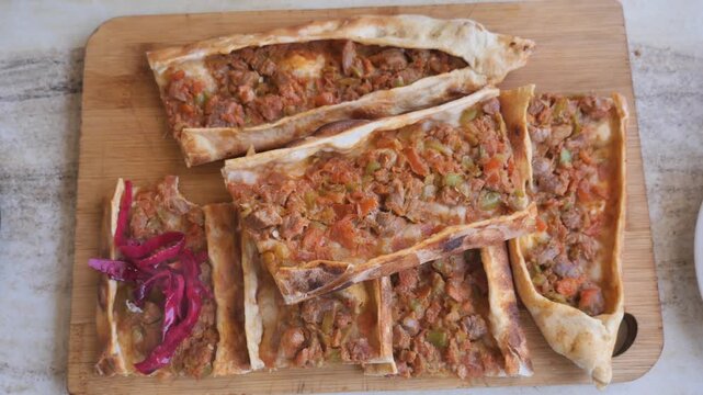 Enjoying delicious pide from a local Turkish restaurant