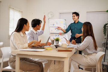 Fototapeta premium Business team collaborating on data charts during office meeting