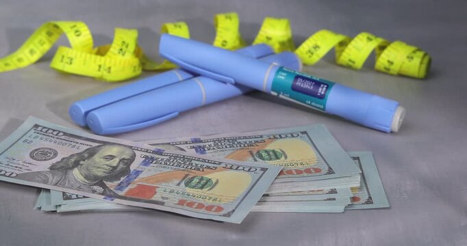Detailed view of semaglutide glp-1 pens and yellow tape on cement with falling hundred dollar bills for representing healthcare prices.
