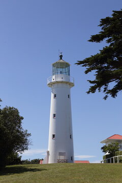 White Lighthouse on Tiritiri Matangi Island under Blue Sky