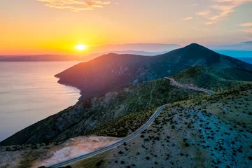 Sunset over tranquil waters, painting the sky in vibrant hues. Location place Kvarner Gulf, Cres island, Croatia, Europe. © Leonid Tit