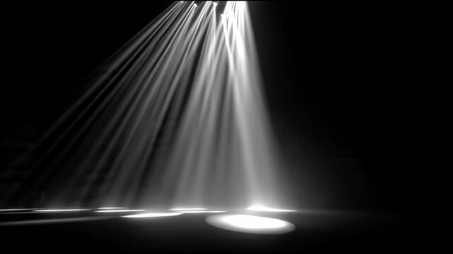 Dramatic White Volumetric Spotlights Sweeping Across Dark Stage