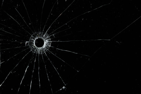 Bullet holes on black glass, overlay design background