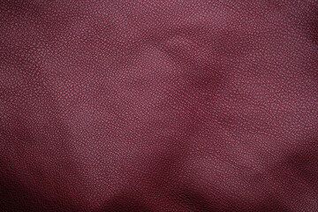 Fototapeta premium Close up of textured deep red leather material