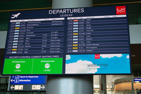 Airport scoreboard, timetable showing international departure times of flights, information display board, Luxembourg city and country