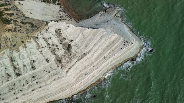 stair of the turks. Aerial view of coastal cliffs with layered white rock formations and turquoise waters, showcasing the natural beauty of the shoreline and surrounding landscape