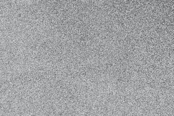Fototapeta premium Detailed rough textured surface of natural gray speckled stone material showing a very fine granular pattern