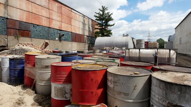 Barrels stand with spent oil products
