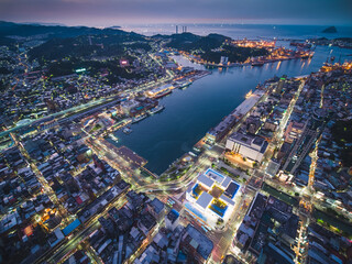 Naklejka premium Aerial View of Keelung City Skyline - Port city concept image. Panoramic cityscape birds eye view use the drone in evening, major port city situated in the northeastern part of Taiwan.
