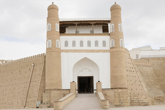 Ark Fortress entrance gate in Bukhara with twin towers and massi