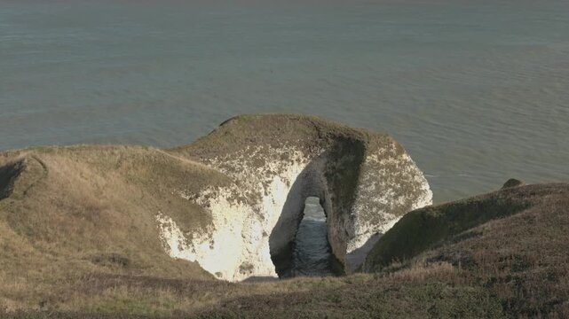 Hand-held shot of white chalk cliff formations at Flamborough Head Lighthouse
