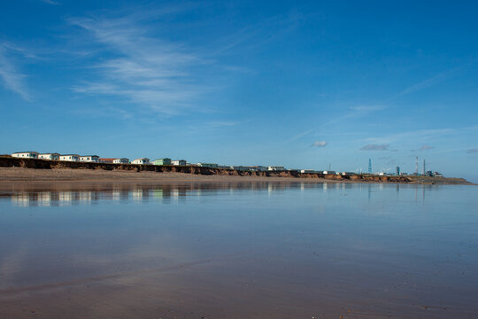 Holiday caravans on clifftop next to Easington gas terminal, the first North Sea gas terminal to be built in 1966 following historic discovery of gas in North Sea in 1965