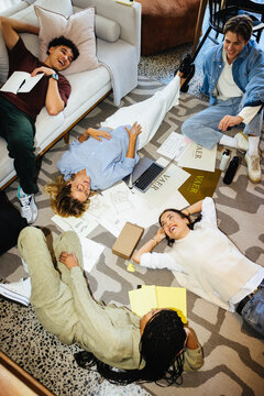 Young professionals collaborating on creative projects in a casual office environment