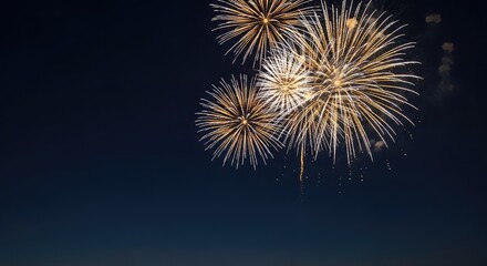 Obraz premium A sophisticated holiday background showcasing radiant golden and silver firework displays exploding across a serene dark blue midnight sky, dark blue, celebration, texture