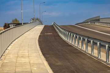 Construction of a new bridge in Częstochowa, the Jacek Magiera Viaduct, an asphalt road over the railway tracks, a road investment to improve urban traffic, an empty road in the city center, acceptanc © dominikspalek.pl