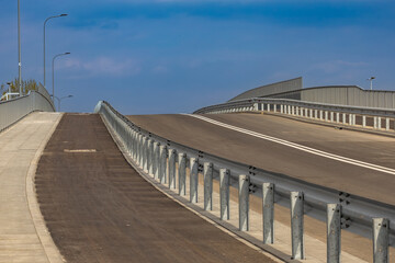 Construction of a new bridge in Częstochowa, the Jacek Magiera Viaduct, an asphalt road over the railway tracks, a road investment to improve urban traffic, an empty road in the city center, acceptanc © dominikspalek.pl
