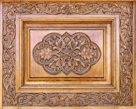 Wooden frame with islamic ornament. Antique wood backdrop with oriental ornaments. Traditional moroccan wood carving shutter with floral decor. Copy space for text
