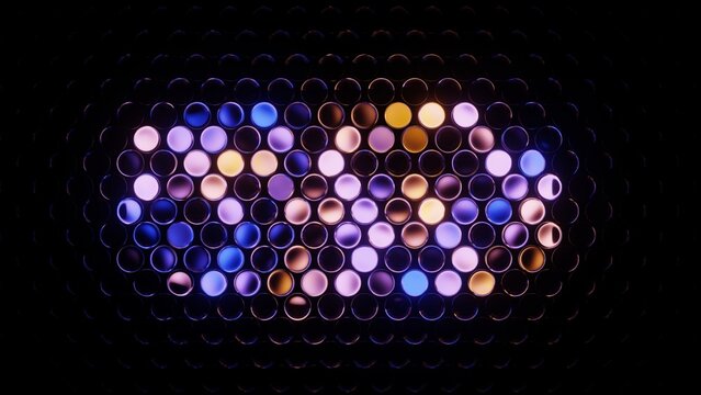 Multicolored round glassy lights on a grid panel glowing with vibrant, rhythmic pattern