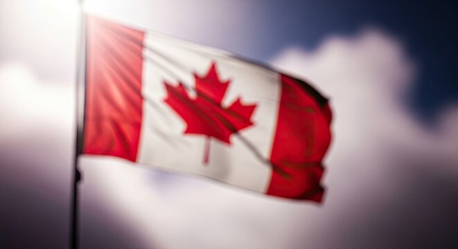 Waving canadian flag against a blurred sky a symbol of national pride