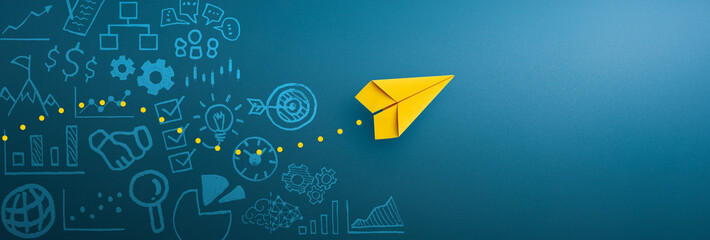 Fototapeta na wymiar Yellow paper plane and business strategy on blue background, Business success, innovation and solution concept, copy space