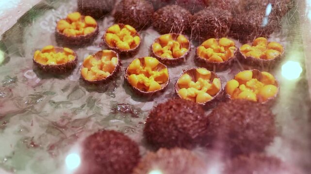 Fresh sea urchins displayed on ice at Tsukiji outer market in Tokyo Japan for sale.