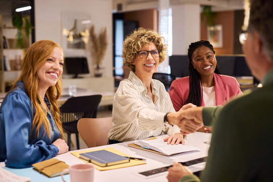 Successful business handshake at creative office