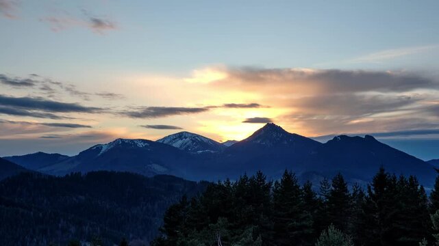 Dusk Mountain Landscape Timelapse with Coniferous Forest Silhouettes
