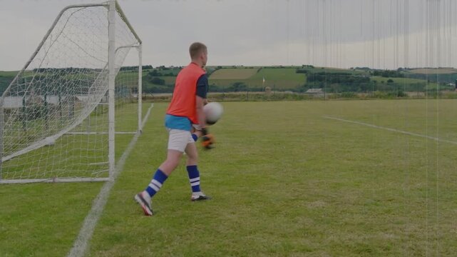 Goalkeeper stepping out after right-side ball, saving and signaling to reset play in football drill