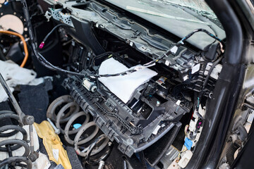 Fototapeta premium Damaged electric car after crash with shattered windshield and front-end destruction