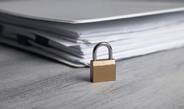 Padlock with a documents. Document security