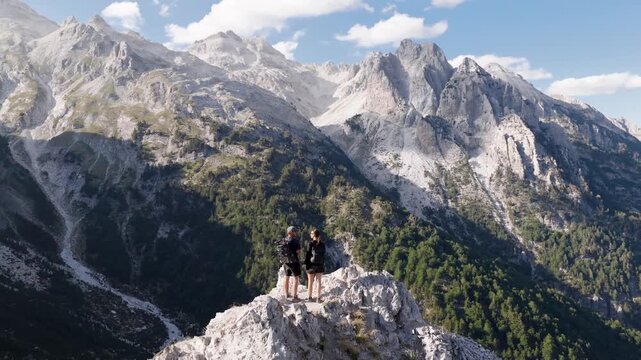 Aerial view of rugged mountain peaks and green valleys meet in a stunning panorama, capturing nature's raw beauty, Teth, Shkoder County, Albania.