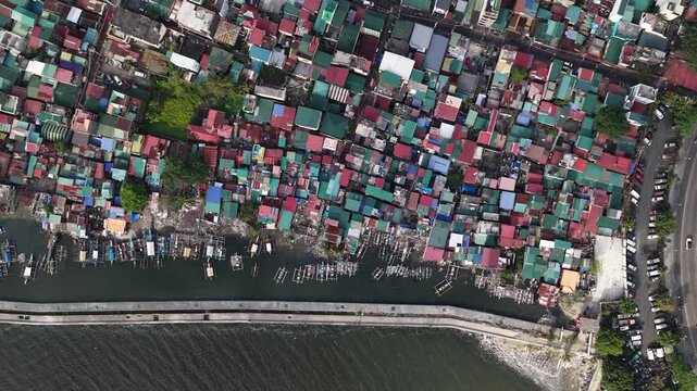 Aerial top down view of a poor coastal community and fishing village