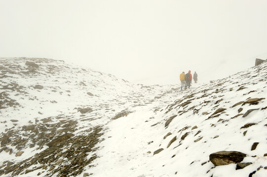 man climbing on the mountain