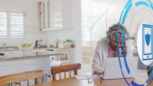 Getting call senior woman holding phone leaning to laptop as HUD sweeping turning growing shielding