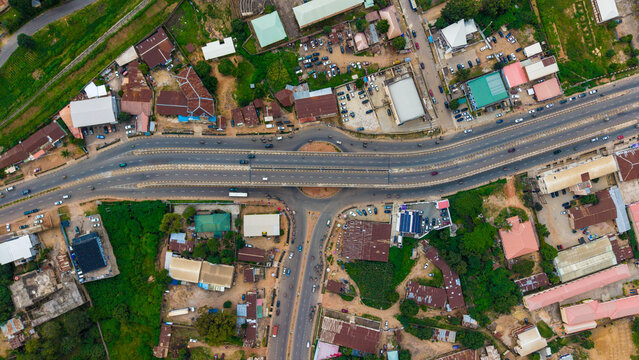 Aerial view of the vibrant roundabout and roadway slicing through the green-patched urban landscape, Awka, Anambra, Nigeria.