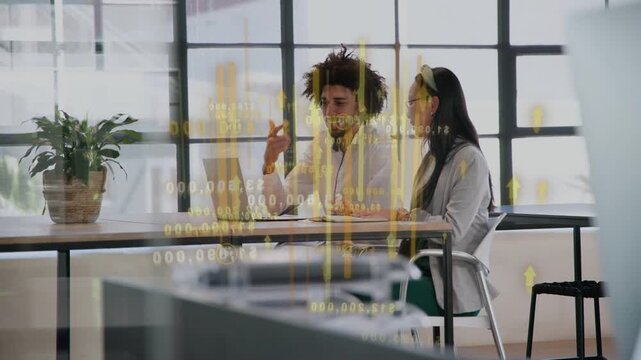 Man tapping laptop, causing yellow finance chart to animate while woman leaning in, reviewing data